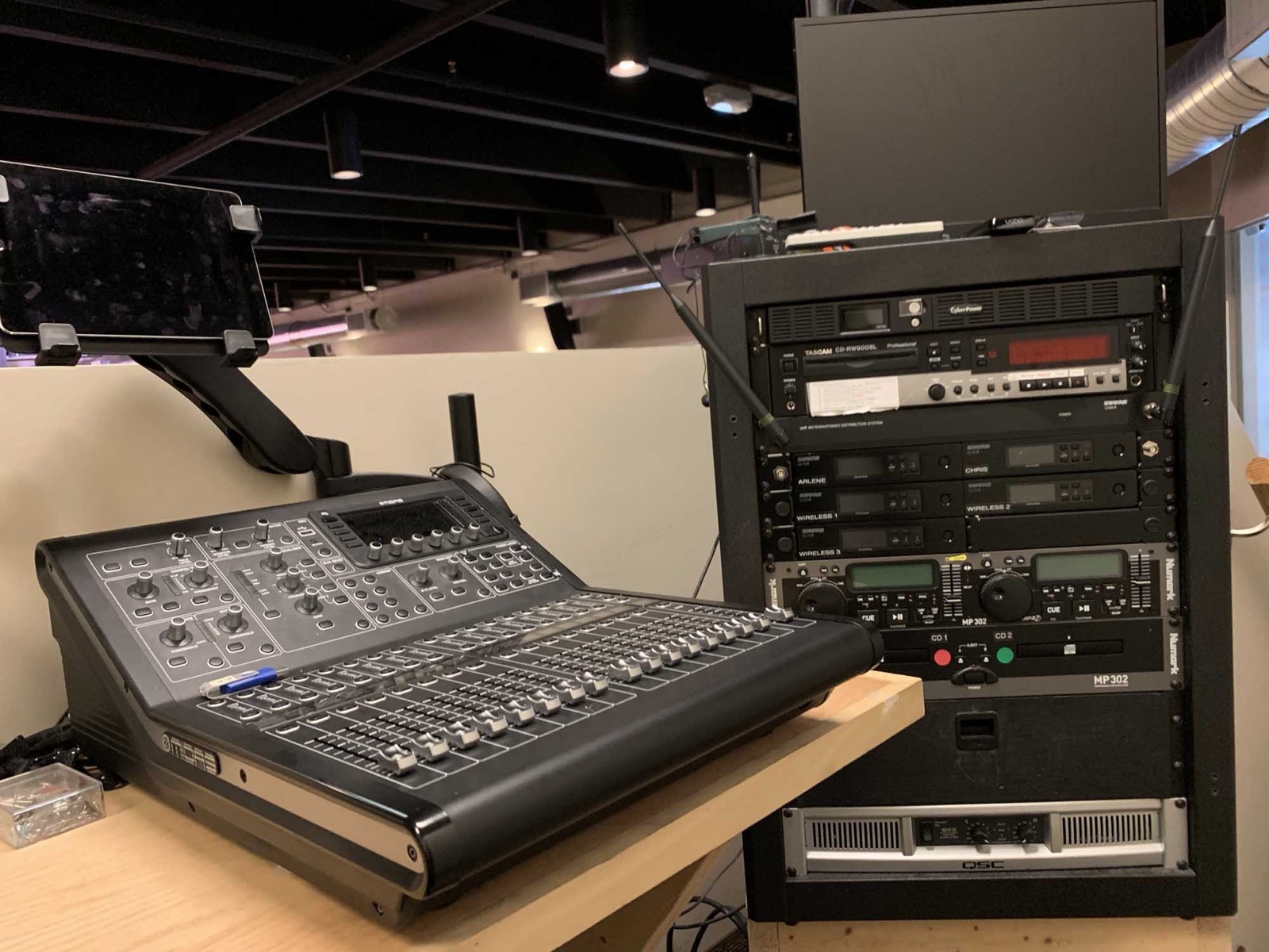 Audio mixing console and equipment rack in the Main Auditorium sound booth at the Oakland Park venue