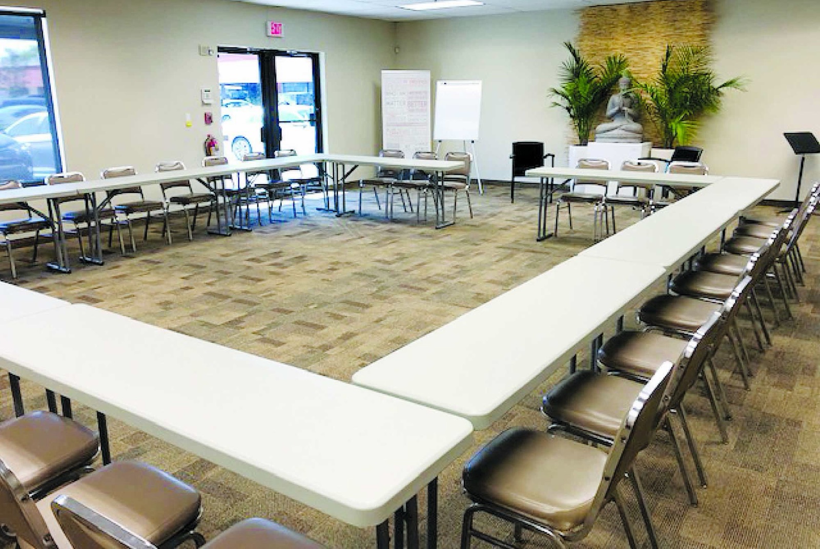 Multipurpose Room in Oakland Park set with tables in a U-shape for a corporate training session