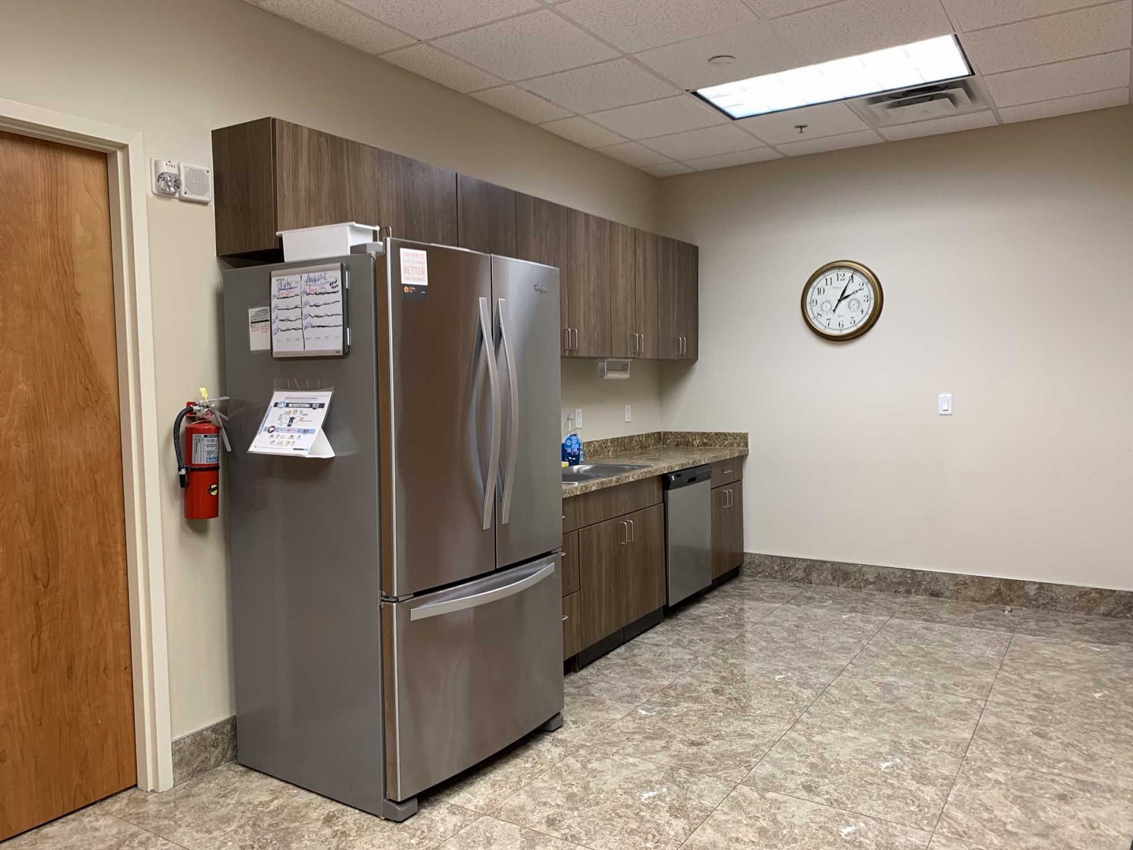 Kitchen at the Center for Spiritual Living in Oakland Park with stainless refrigerator and granite counters for caterers