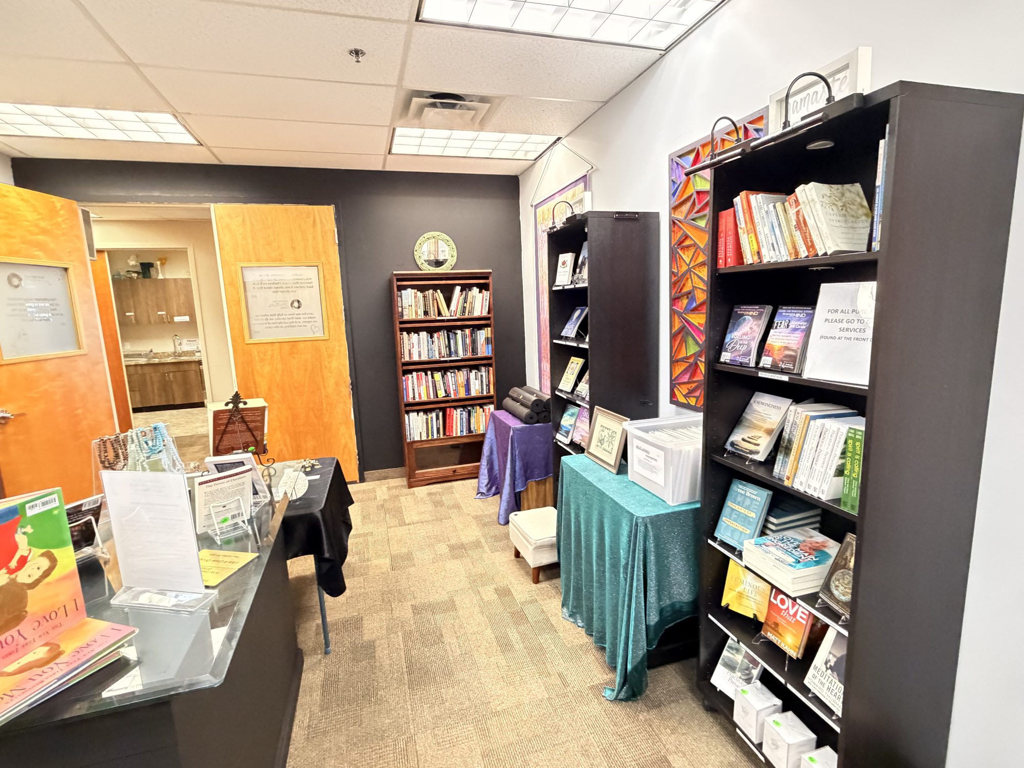Bookshelves, gift tables and reading chairs in the CSL bookstore